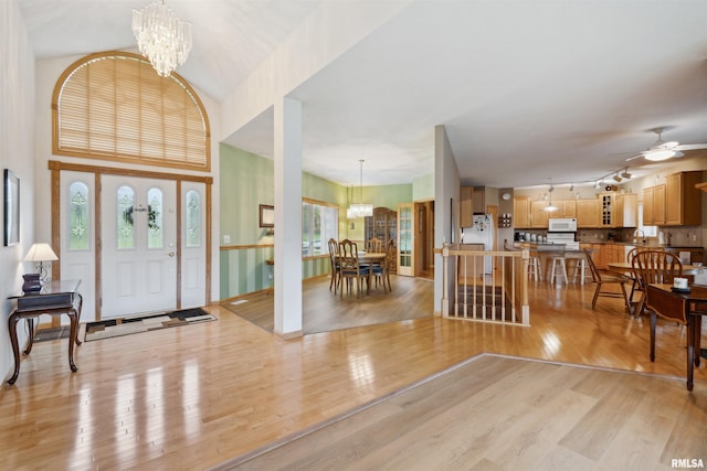 23835 284th Ave, Le Claire, IA 52748 - entryway featuring a chandelier, light wood-type flooring, and a ceiling fan