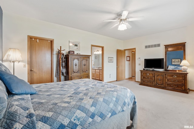 23835 284th Ave, Le Claire, IA 52748 - bedroom featuring light carpet, baseboards, ceiling fan, and ensuite bath