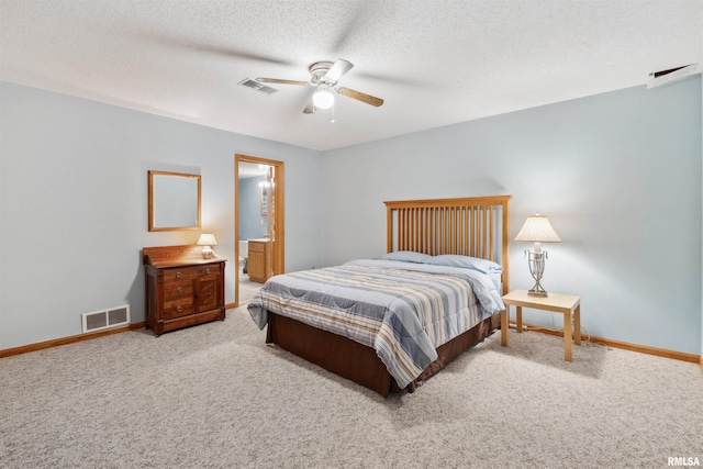 23835 284th Ave, Le Claire, IA 52748 - bedroom with carpet flooring, baseboards, a ceiling fan, and a textured ceiling