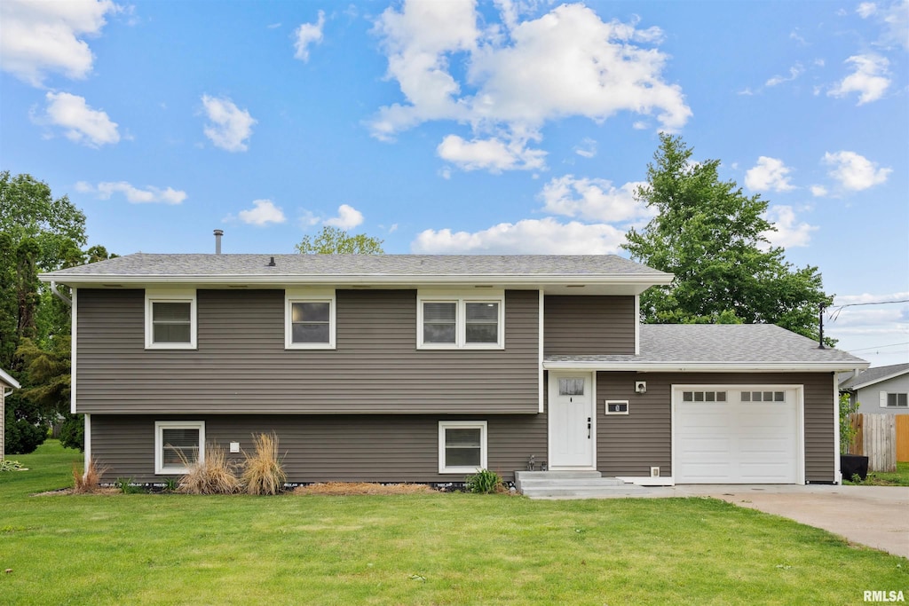 621 E Locust St, Geneseo, IL 61254 - tri-level home featuring a garage, driveway, and roof with shingles