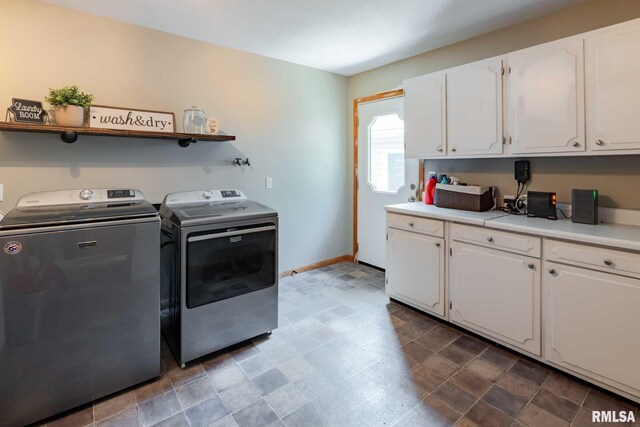 324 N Broadway, Goreville, IL 62939 - laundry room featuring separate washer and dryer, cabinet space, and baseboards