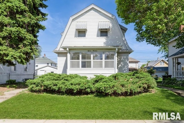 1513 41st St, Rock Island, IL 61201 - dutch colonial featuring a front yard and a gambrel roof