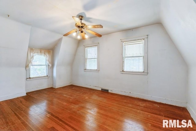 1513 41st St, Rock Island, IL 61201 - additional living space featuring hardwood / wood-style floors, vaulted ceiling, healthy amount of natural light, and a ceiling fan