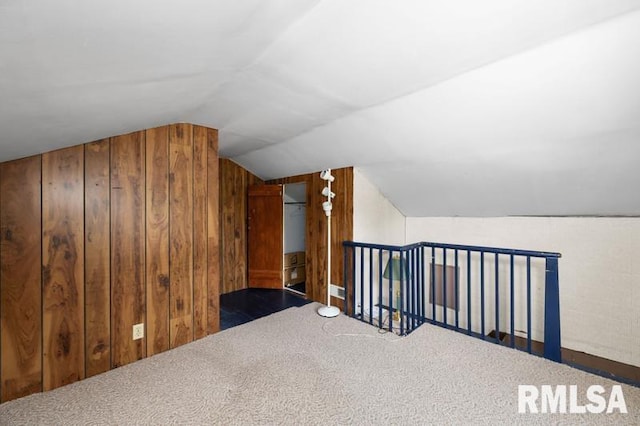 824 S State St, Geneseo, IL 61254 - bonus room with wood walls, vaulted ceiling, and carpet floors