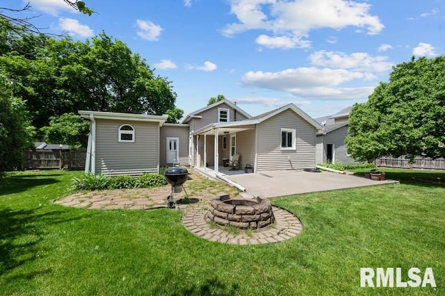 824 S State St, Geneseo, IL 61254 - back of property with a patio, an outdoor fire pit, and an outdoor structure