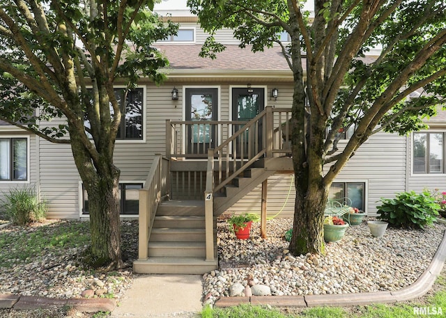 2112 35th St Unit 3, Rock Island, IL 61201 - view of front of property with stairs, a deck, and a shingled roof