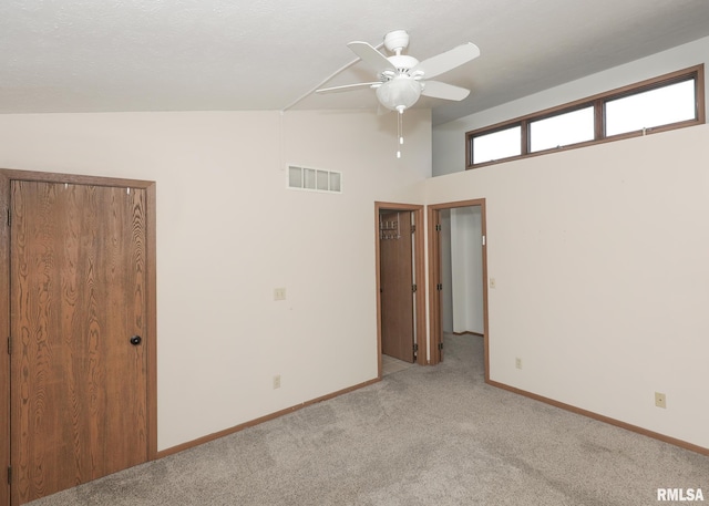 2112 35th St Unit 3, Rock Island, IL 61201 - unfurnished bedroom with light colored carpet, baseboards, and a ceiling fan