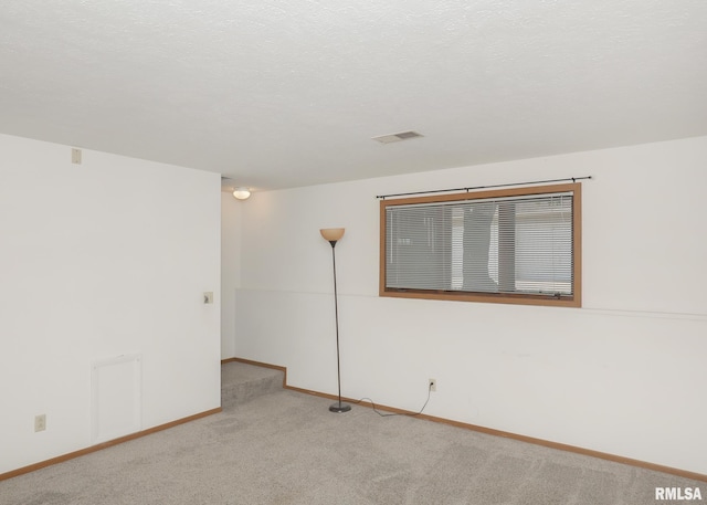 2112 35th St Unit 3, Rock Island, IL 61201 - spare room with light carpet and baseboards