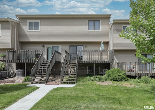 2112 35th St Unit 3, Rock Island, IL 61201 - back of house featuring stairway, a wooden deck, a lawn, and cooling unit