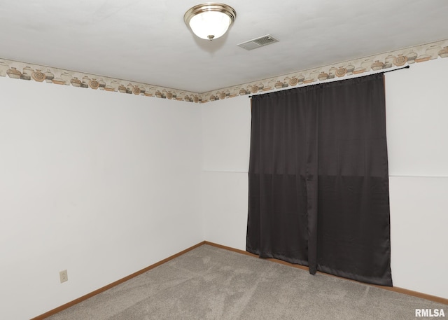 2112 35th St Unit 3, Rock Island, IL 61201 - unfurnished room featuring baseboards and light colored carpet