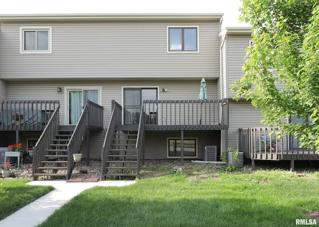 2112 35th St Unit 3, Rock Island, IL 61201 - back of property with stairway, a deck, a lawn, and central AC
