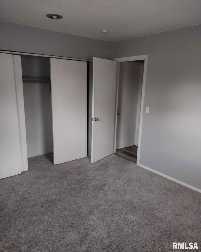 2705 N Lincoln Ave, Davenport, IA 52804 - unfurnished bedroom with carpet floors and a closet