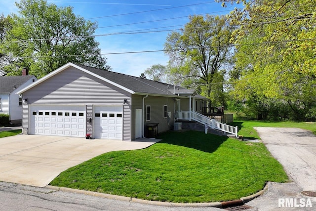 view of front of house with a front lawn, driveway, a garage, and central air condition unit