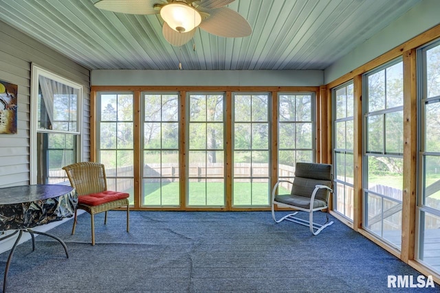 sunroom with a ceiling fan