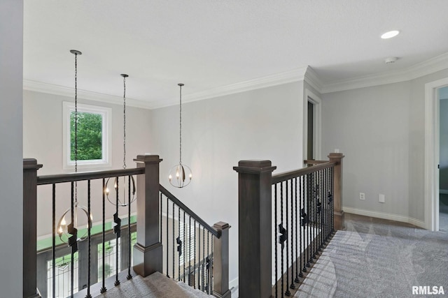 6531 Eagle Ridge Rd, Bettendorf, IA 52722 - corridor with a chandelier, an upstairs landing, ornamental molding, baseboards, and carpet flooring