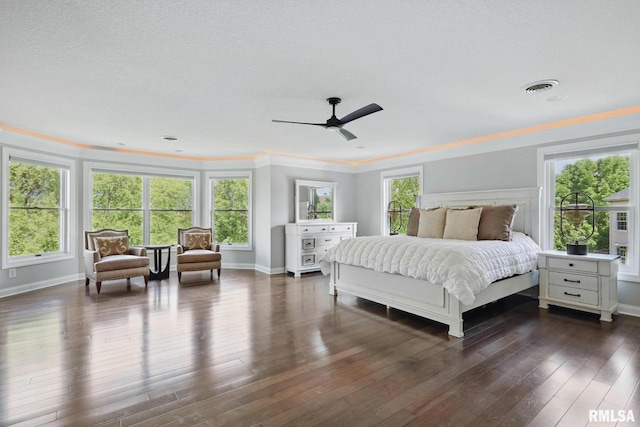 6531 Eagle Ridge Rd, Bettendorf, IA 52722 - bedroom featuring baseboards, dark wood-type flooring, crown molding, and ceiling fan