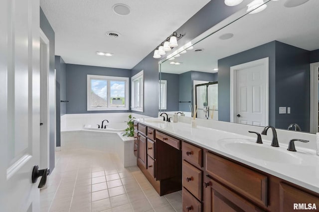 6531 Eagle Ridge Rd, Bettendorf, IA 52722 - full bath featuring a garden tub, tile patterned flooring, double vanity, and a stall shower