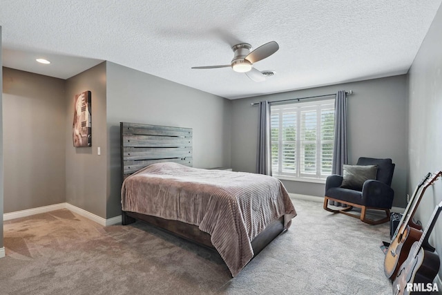 6531 Eagle Ridge Rd, Bettendorf, IA 52722 - bedroom with carpet floors, baseboards, a ceiling fan, and a textured ceiling