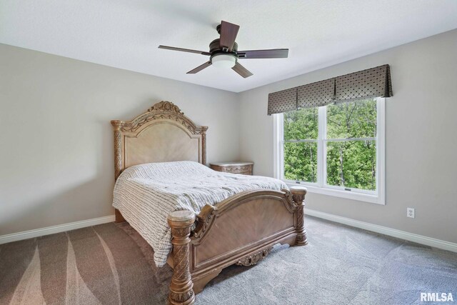 6531 Eagle Ridge Rd, Bettendorf, IA 52722 - carpeted bedroom with baseboards and a ceiling fan