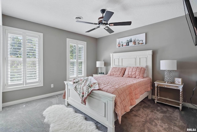 6531 Eagle Ridge Rd, Bettendorf, IA 52722 - carpeted bedroom featuring baseboards, a ceiling fan, and a textured ceiling