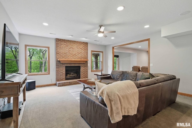 6531 Eagle Ridge Rd, Bettendorf, IA 52722 - living room featuring ceiling fan, carpet, baseboards, a fireplace, and recessed lighting