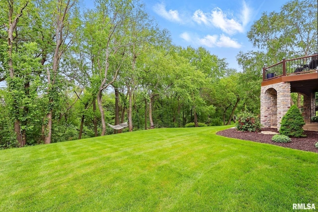 6531 Eagle Ridge Rd, Bettendorf, IA 52722 - view of green lawn with a wooden deck