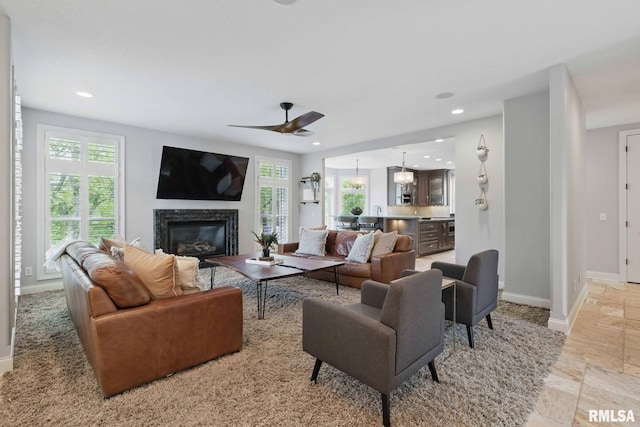 6531 Eagle Ridge Rd, Bettendorf, IA 52722 - living room featuring baseboards, a premium fireplace, recessed lighting, and a ceiling fan
