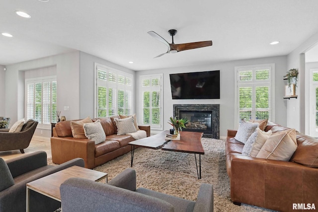 6531 Eagle Ridge Rd, Bettendorf, IA 52722 - living room with recessed lighting, a ceiling fan, and a high end fireplace