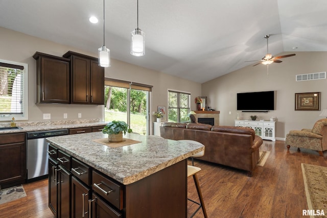 11 Musket Ct, Le Claire, IA 52753 - kitchen with stainless steel dishwasher, lofted ceiling, ceiling fan, a breakfast bar, and open floor plan