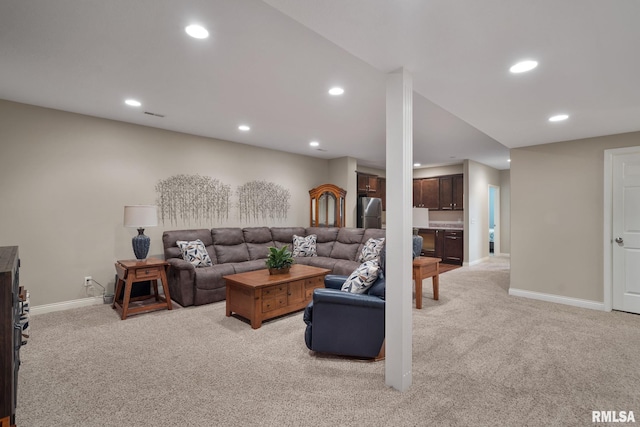 11 Musket Ct, Le Claire, IA 52753 - living area featuring light colored carpet, recessed lighting, and baseboards