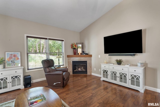 11 Musket Ct, Le Claire, IA 52753 - living area with lofted ceiling, wood finished floors, baseboards, and a tiled fireplace