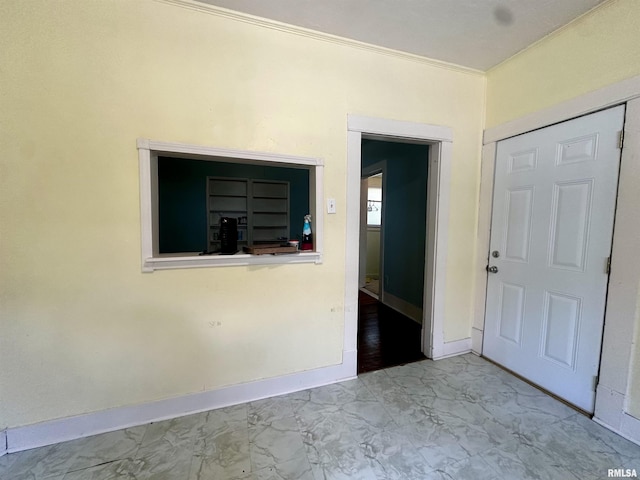 2213 Locust St, Eldorado, IL 62930 - spare room featuring marble finish flooring, baseboards, and ornamental molding