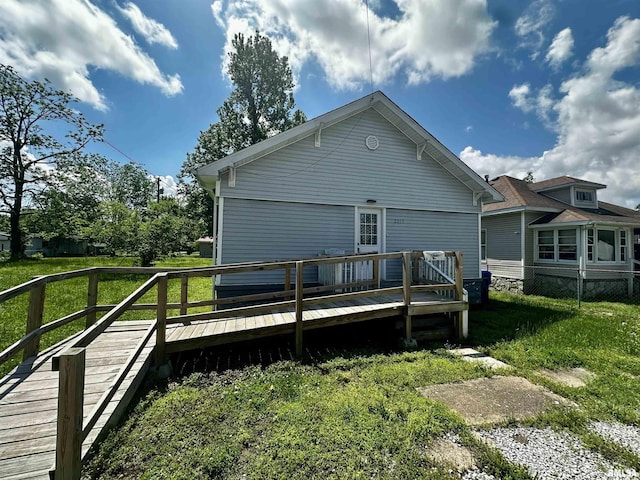 2213 Locust St, Eldorado, IL 62930 - back of house featuring a deck and a lawn
