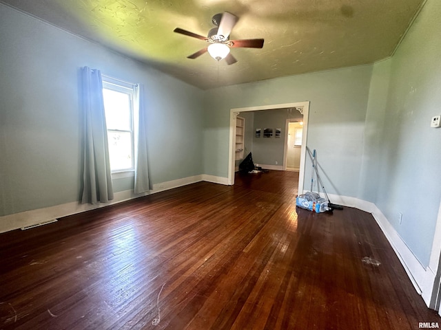 2213 Locust St, Eldorado, IL 62930 - empty room with wood-type flooring, ceiling fan, and baseboards