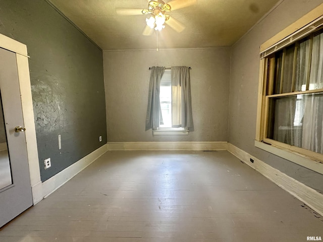 2213 Locust St, Eldorado, IL 62930 - empty room with ceiling fan and hardwood / wood-style floors