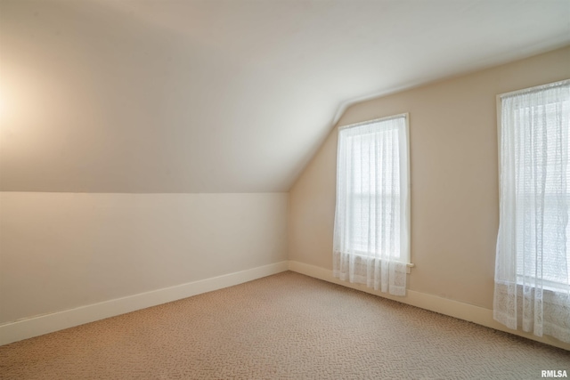2006 Dixwell St, Davenport, IA 52802 - additional living space with lofted ceiling, light carpet, and baseboards