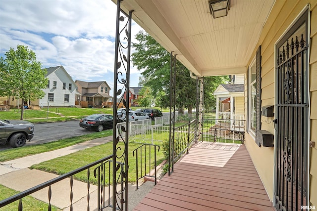 2006 Dixwell St, Davenport, IA 52802 - porch featuring a residential view and a yard