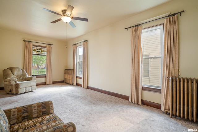 2006 Dixwell St, Davenport, IA 52802 - sitting room with radiator, carpet floors, a ceiling fan, and baseboards