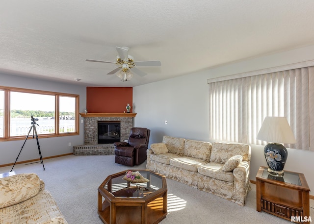 10 Lighthouse Ln Unit 10, Hampton, IL 61256 - living room with carpet, a ceiling fan, a brick fireplace, and baseboards