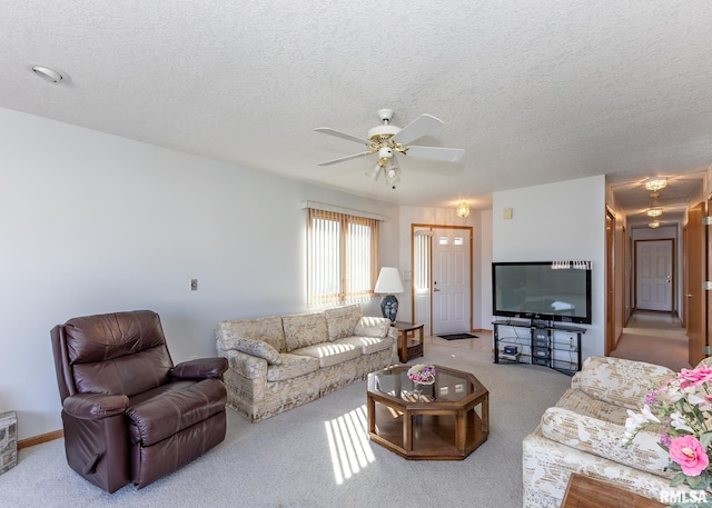 10 Lighthouse Ln Unit 10, Hampton, IL 61256 - carpeted living area featuring a ceiling fan and a textured ceiling