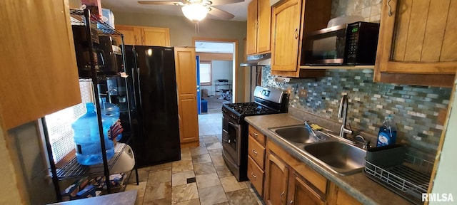 601 E St S, Kewanee, IL 61443 - kitchen featuring stainless steel range with gas stovetop, a sink, decorative backsplash, a ceiling fan, and under cabinet range hood