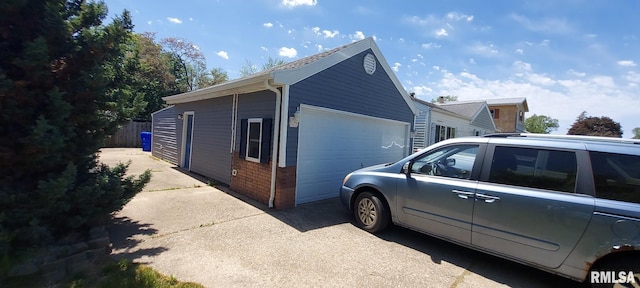 601 E St S, Kewanee, IL 61443 - view of side of property featuring brick siding and fence