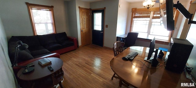 601 E St S, Kewanee, IL 61443 - living area featuring hardwood / wood-style floors and a chandelier