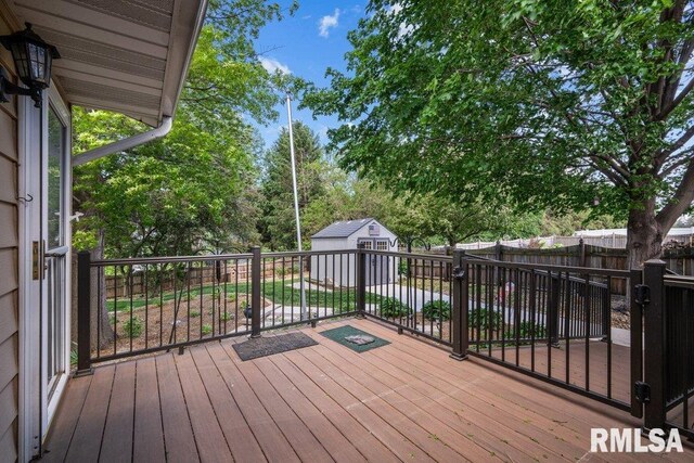 5117 Woodland Ave, Davenport, IA 52807 - wooden deck with a fenced backyard