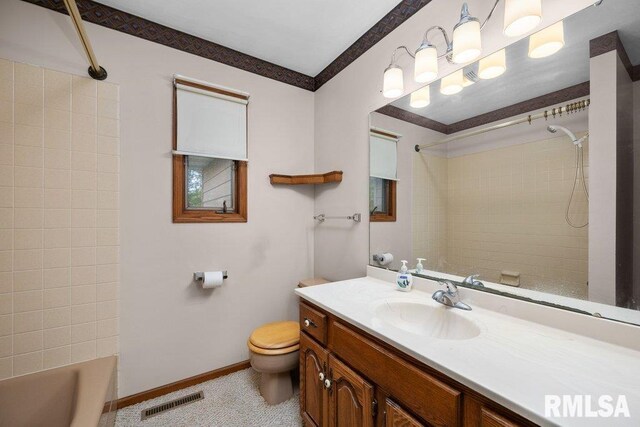 5117 Woodland Ave, Davenport, IA 52807 - full bathroom with toilet, vanity, baseboards, and shower / washtub combination