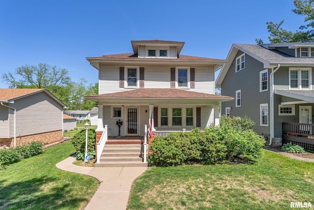 2707 Grand Ave, Davenport, IA 52803 - american foursquare style home featuring covered porch and a front lawn