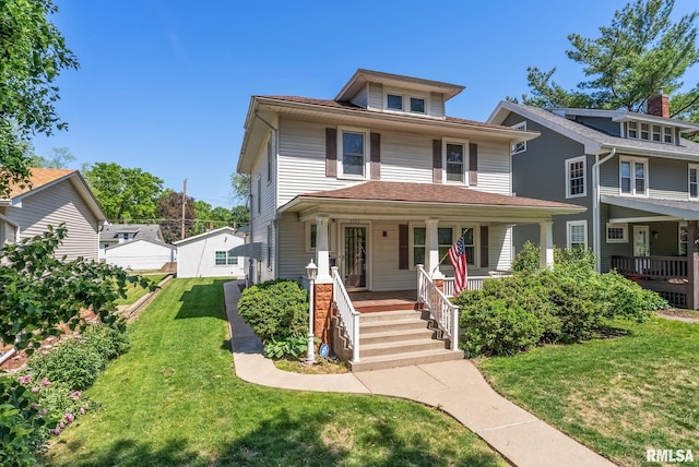 2707 Grand Ave, Davenport, IA 52803 - american foursquare style home featuring a porch and a front lawn