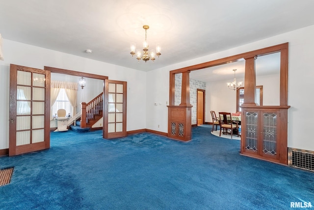 2707 Grand Ave, Davenport, IA 52803 - spare room with a chandelier, carpet floors, and french doors