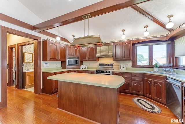 2707 Grand Ave, Davenport, IA 52803 - kitchen with appliances with stainless steel finishes, a sink, wood finished floors, and light countertops