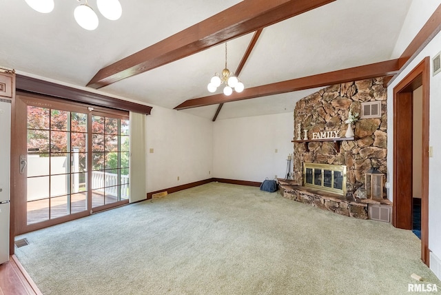 2707 Grand Ave, Davenport, IA 52803 - unfurnished living room featuring a chandelier, carpet, a fireplace, and baseboards
